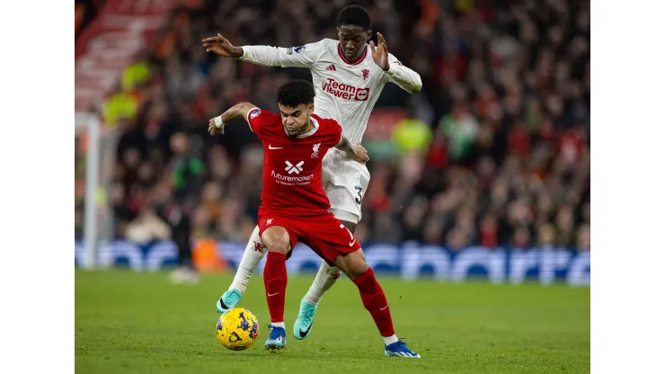 231218 — LIVERPOOL, Dec. 18, 2023 — Liverpool s Luis Diaz L is challenged by Manchester United, ManU s Kobbie Mainoo during the English Premier League match between Liverpool and Manchester United in Liverpool, Britain, on Dec. 17, 2023. FOR EDITORIAL USE ONLY. NOT FOR SALE FOR MARKETING OR ADVERTISING CAMPAIGNS. NO USE WITH UNAUTHORIZED AUDIO, VIDEO, DATA, FIXTURE LISTS, CLUB/LEAGUE LOGOS OR LIVE SERVICES. ONLINE IN-MATCH USE LIMITED TO 45 IMAGES, NO VIDEO EMULATION. NO USE IN BETTING, GAMES OR SINGLE CLUB/LEAGUE/PLAYER PUBLICATIONS. SPBRITAIN-LIVERPOOL-FOOTBALL-ENGLISH PREMIER LEAGUE-LIVERPOOL VS MANCHESTER UNITED LixYing PUBLICATIONxNOTxINxCHN