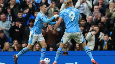 Haaland nets four as Man City keep pace in title race