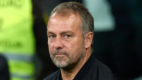 Hansi Flick, Head Coach of FC Barcelona, looks on prior to the LaLiga match between Real Madrid CF and FC Barcelona at Estadio Santiago Bernabeu on October 26, 2024 in Madrid, Spain.