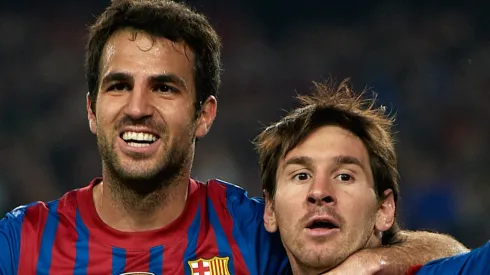 Lionel Messi (R) of Barcelona celebrates with team-mate Cesc Fabregas after scoring the opening goal during the UEFA Champions League quarter-final second leg match between FC Barcelona and AC Milan at the Camp Nou stadium on April 3, 2012 in Barcelona, Spain.