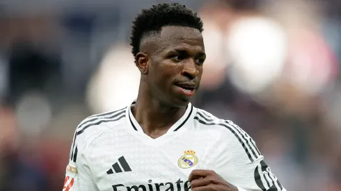 Vinicius Junior of Real Madrid celebrates scoring his team's fourth goal and completing his hat trick during the LaLiga match between Real Madrid CF and CA Osasuna at Estadio Santiago Bernabeu on November 09, 2024 in Madrid, Spain.