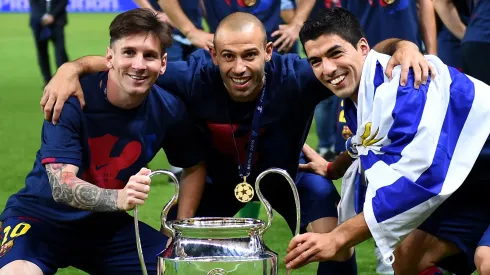 Lionel Messi, Javier Mascherano and Luis Suarez of Barcelona celebrate with the trophy after the UEFA Champions League Final between Juventus and FC Barcelona at Olympiastadion on June 6, 2015 in Berlin, Germany.