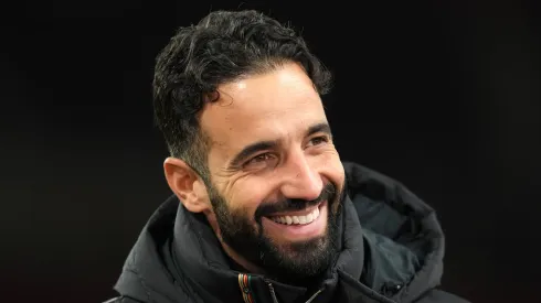 Manchester United head coach Ruben Amorim smiling.