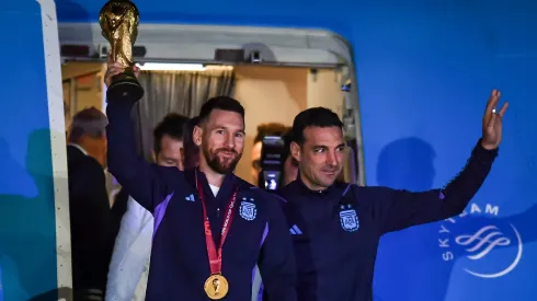 Lionel Messi of Argentina (L) and Lionel Scaloni (R) holds the FIFA World Cup during the arrival of the Argentina men's national football team after winning the FIFA World Cup Qatar 2022 on December 20, 2022 in Buenos Aires, Argentina.