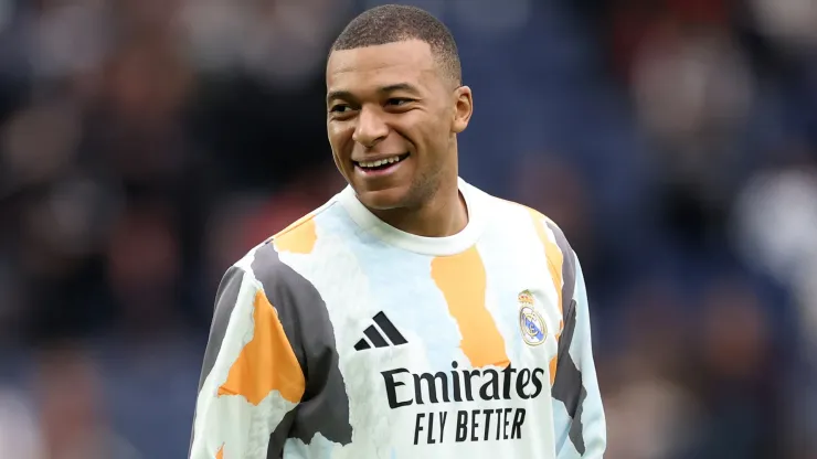 Kylian Mbappe of Real Madrid smiles during the warm up prior to the LaLiga match between Real Madrid CF and Valencia CF at Estadio Santiago Bernabeu on April 05, 2025 in Madrid, Spain.