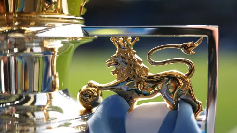 A detailed view of the Premier League Trophy as it is displayed inside the stadium.
