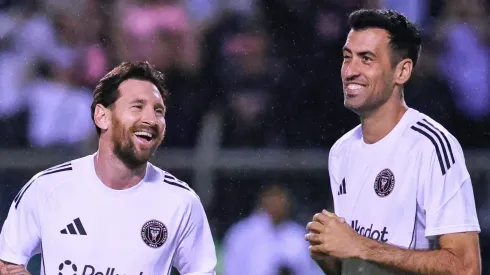Lionel Messi of Inter Miami speaks with Sergio Busquets of Inter Miami during the warm-ups prior to prior to a friendly match between Olimpia and Inter Miami at Estadio Olimpico Metropolitano on February 08, 2025 in San Pedro Sula, Honduras.