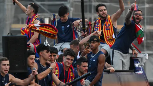 Lamine Yamal of FC Barcelona and his team mates celebrates as Barcelona fans welcome players during the 28th LaLiga Trophy victory parade on May 16, 2025 in Barcelona, Spain.