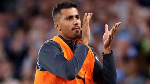 Rodri of Manchester City applauds the fans as he warms up during the Premier League match between Manchester City FC and AFC Bournemouth at Etihad Stadium on May 20, 2025 in Manchester, England.