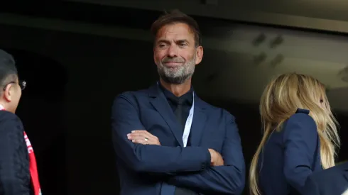 Former Liverpool Manager and current Head of Global Soccer for Red Bull GmbH Juergen Klopp looks on from an executive box prior to the Premier League match between Liverpool FC and Crystal Palace FC at Anfield on May 25, 2025 in Liverpool, England.