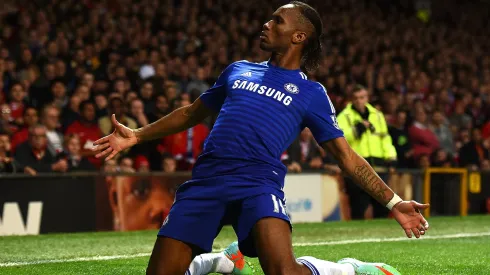 Didier Drogba of Chelsea celebrates scoring the first goal during the Barclays Premier League match between Manchester United and Chelsea at Old Trafford on October 26, 2014 in Manchester, England.