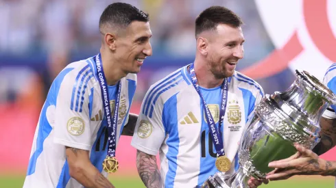 Angel Di Maria, Lionel Messi and Nicolas Otamendi of Argentina celebrate with the trophy after the team's victory in the CONMEBOL Copa America 2024 Final match between Argentina and Colombia at Hard Rock Stadium on July 15, 2024 in Miami Gardens, Florida.