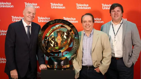 FIFA President Gianni Infantino (L), TelevisaUnivision CEO Daniel Alegre (M), and TelevisaUnivision President of Global Sports Olek Loewenstein (R) with the FIFA Club World Cup.