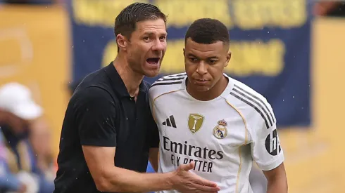 Kylian Mbappe #9 of Real Madrid C.F. speaks with Xabi Alonso, Head Coach of Real Madrid C.F., as he enters the pitch during the FIFA Club World Cup 2025 round of 16 match between Real Madrid CF and Juventus FC at Hard Rock Stadium on July 01, 2025 in Miami Gardens, Florida.