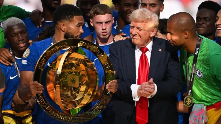Reece James #24 of Chelsea FC holds the FIFA Club World Cup trophy after their team's victory as U.S. President Donald Trump interacts with Robert Sanchez #1 of Chelsea FC following the FIFA Club World Cup 2025 Final match between Chelsea FC and Paris Saint-Germain at MetLife Stadium on July 13, 2025 in East Rutherford, New Jersey.