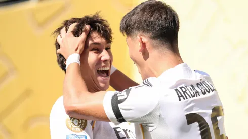 Gonzalo Garcia #30 and Arda Gueler #15 of Real Madrid celebrating a goal.