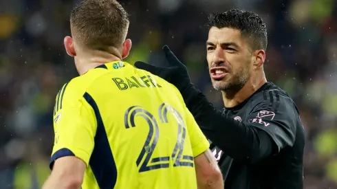 Luis Suarez #9 of Inter Miami CF clashes with Josh Bauer #22 of Nashville SC