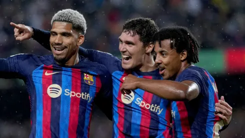 Andreas Christensen of FC Barcelona celebrates with teammates Ronald Araujo and Jules Kounde of FC Barcelona.