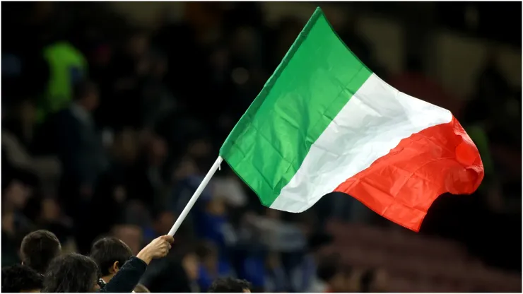 An Italy flag is waved