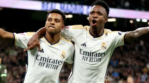 Rodrygo of Real Madrid celebrates scoring his team's fourth goal with teammate Vinicius Junior.
