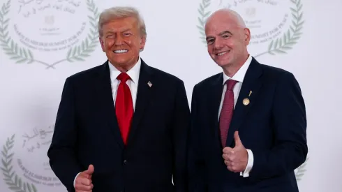 U.S. President Donald Trump and FIFA president Gianni Infantino pose for a photo at a world leaders' summit.