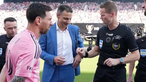 Referee Drew Fischer performs the coin toss with Captains Lionel Messi #10 of Inter Miami CF