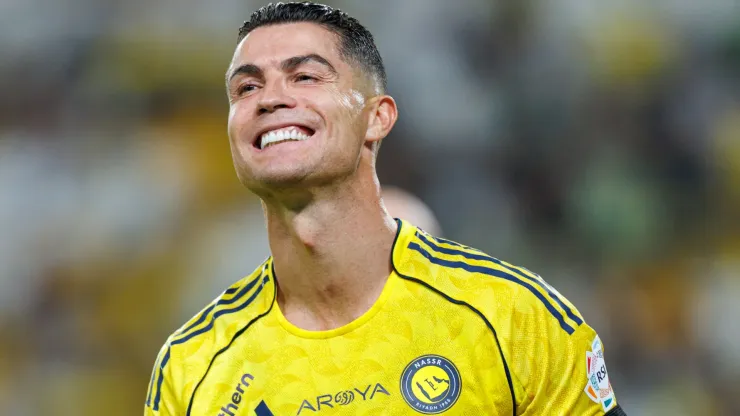 Al Nassr star Cristiano Ronaldo smiling in a Saudi Pro League game.