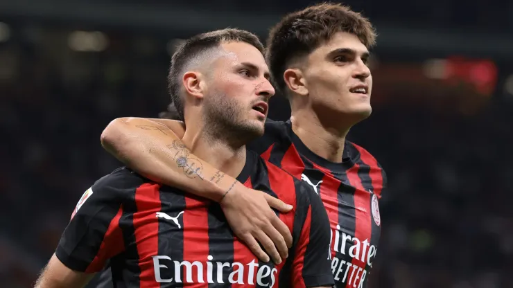 Santiago Gimenez of AC Milan celebrates a goal with Davide Bartesaghi.