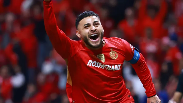 Alexis Vega of Toluca celebrates after scoring the winning penalty.