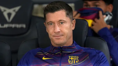 Robert Lewandowski of FC Barcelona looks on from the bench.