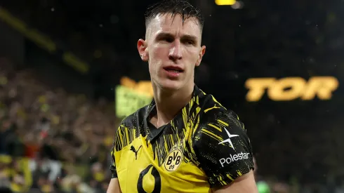 Nico Schlotterbeck of Borussia Dortmund celebrates after scoring a goal.