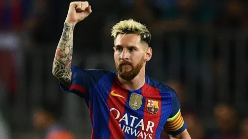 Lionel Messi celebrates scoring a goal during a UEFA Champions League game with Barcelona in 2016.