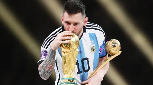 Lionel Messi of Argentina kisses the FIFA World Cup Qatar 2022 Winners' Trophy.