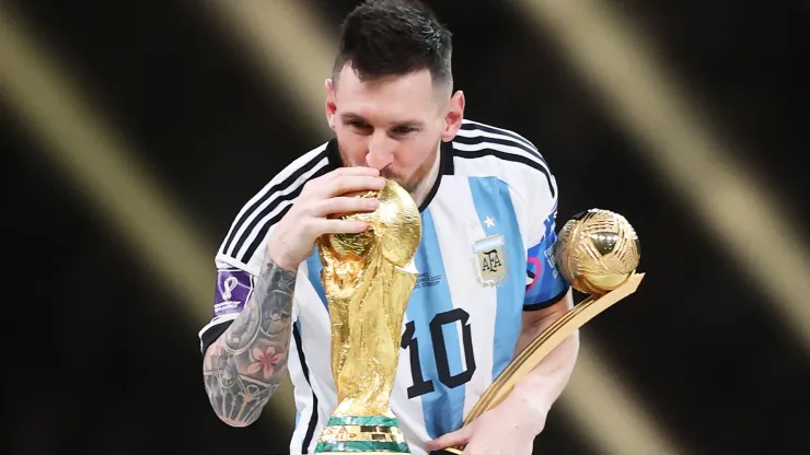 Lionel Messi of Argentina kisses the FIFA World Cup Qatar 2022 Winners' Trophy.