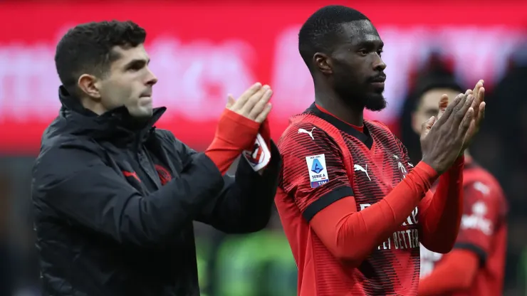 Fikayo Tomori (R) and Christian Pulisic (L) of AC Milan applaud the fans