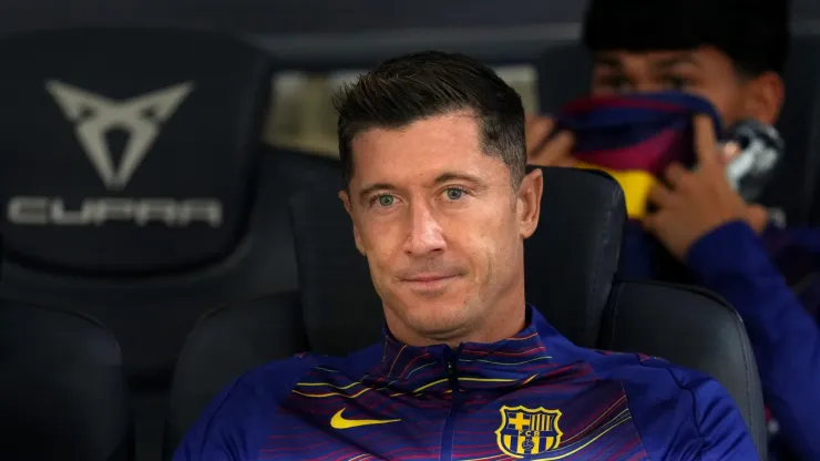 Robert Lewandowski of FC Barcelona looks on from the bench.