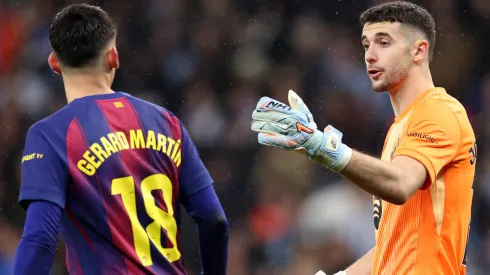 Joan Garcia and Gerard Martin of FC Barcelona interact