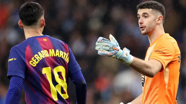 Joan Garcia and Gerard Martin of FC Barcelona interact