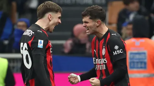 Christian Pulisic of AC Milan celebrates with his team-mate Alexis Saelemaekers.