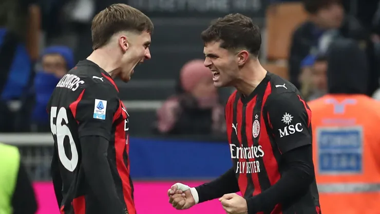 Christian Pulisic of AC Milan celebrates with his team-mate Alexis Saelemaekers.