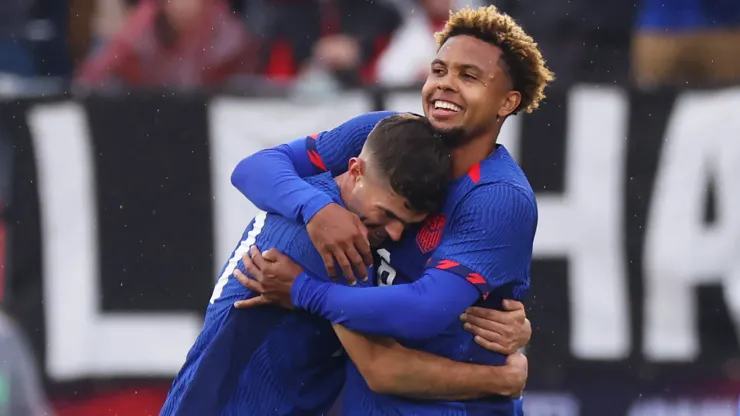 Weston McKennie #8 of the United States is and Christian Pulisic #10