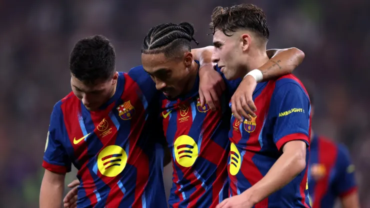 Raphinha of FC Barcelona celebrating with Fermin Lopez and Roony Bardghji.