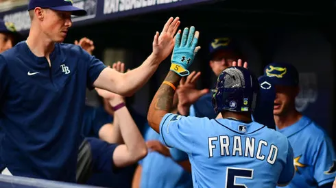 ST PETERSBURG, FL - APRIL 10: Wander Franco #5 of the Tampa Bay Rays celebrates with teammates after scoring in the seventh inning against the Baltimore Orioles at Tropicana Field on April 10, 2022 in St Petersburg, Florida. (Photo by Julio Aguilar/Getty Images)