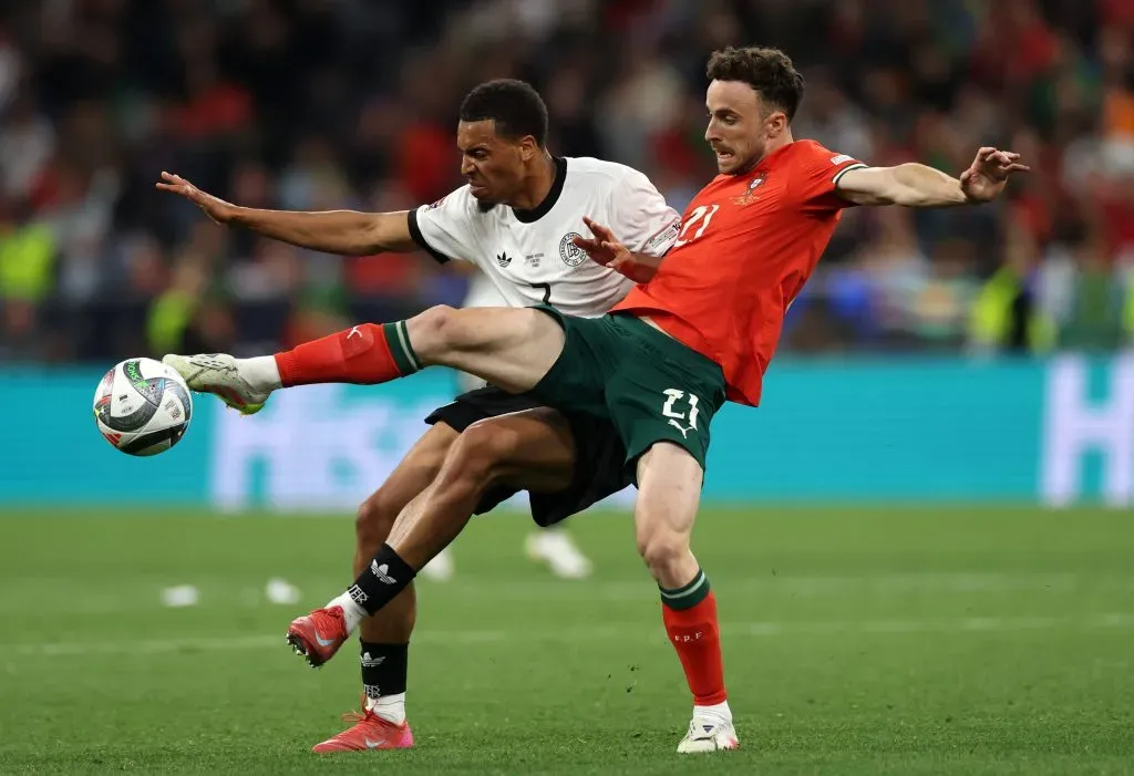 MUNICH, GERMANY – JUNE 04: Felix Nmecha of Germany is challenged by Diogo Jota of Portugal during the UEFA Nations League 2025 semifinal match between Germany and Portugal at Munich Football Arena on June 04, 2025 in Munich, Germany. (Photo by Lars Baron/Getty Images)