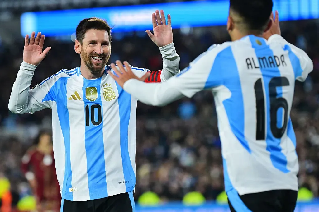 BUENOS AIRES, ARGENTINA – SEPTEMBER 04: Lionel Messi of Argentina celebrates with teammate Thiago Almada after scoring the team’s third goal during the South American FIFA World Cup 2026 Qualifier match between Argentina and Venezuela at Estadio Más Monumental Antonio Vespucio Liberti on September 04, 2025 in Buenos Aires, Argentina. (Photo by Marcelo Endelli/Getty Images)