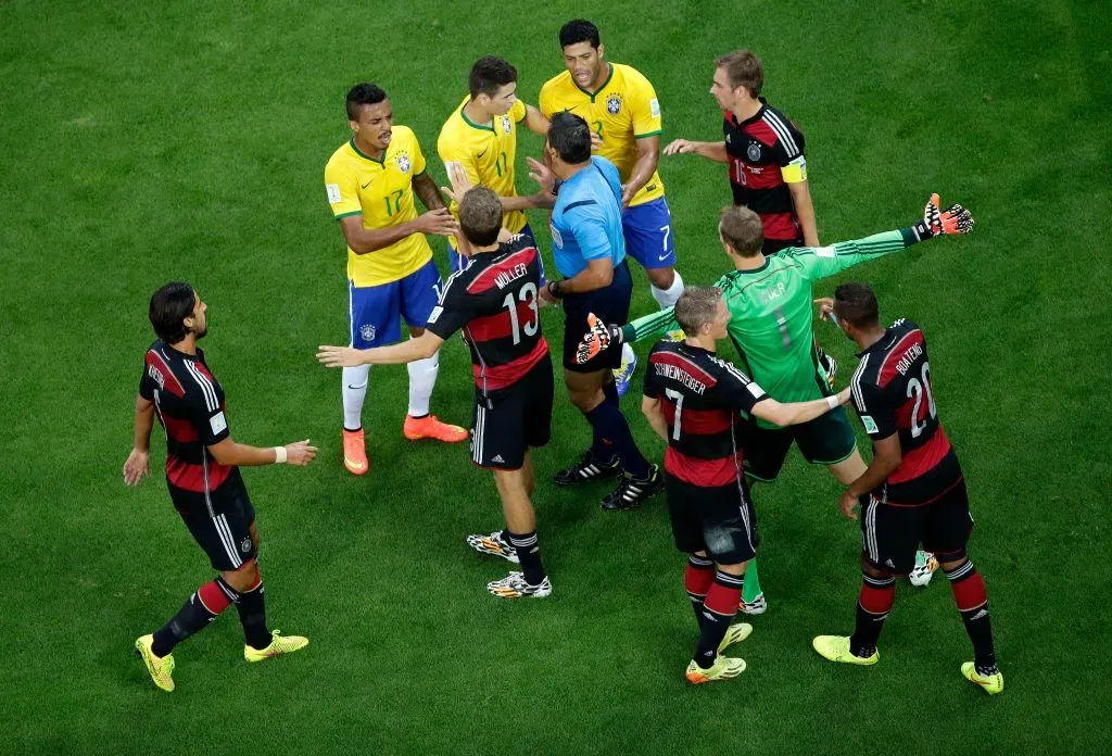 BELO HORIZONTE, BRAZIL – JULY 08: Referee Marco Rodriguez restores order after a challenge during the 2014 FIFA World Cup Brazil Semi Final match between Brazil and Germany at Estadio Mineirao on July 8, 2014 in Belo Horizonte, Brazil. (Photo by Felipe Dana – Pool/Getty Images)