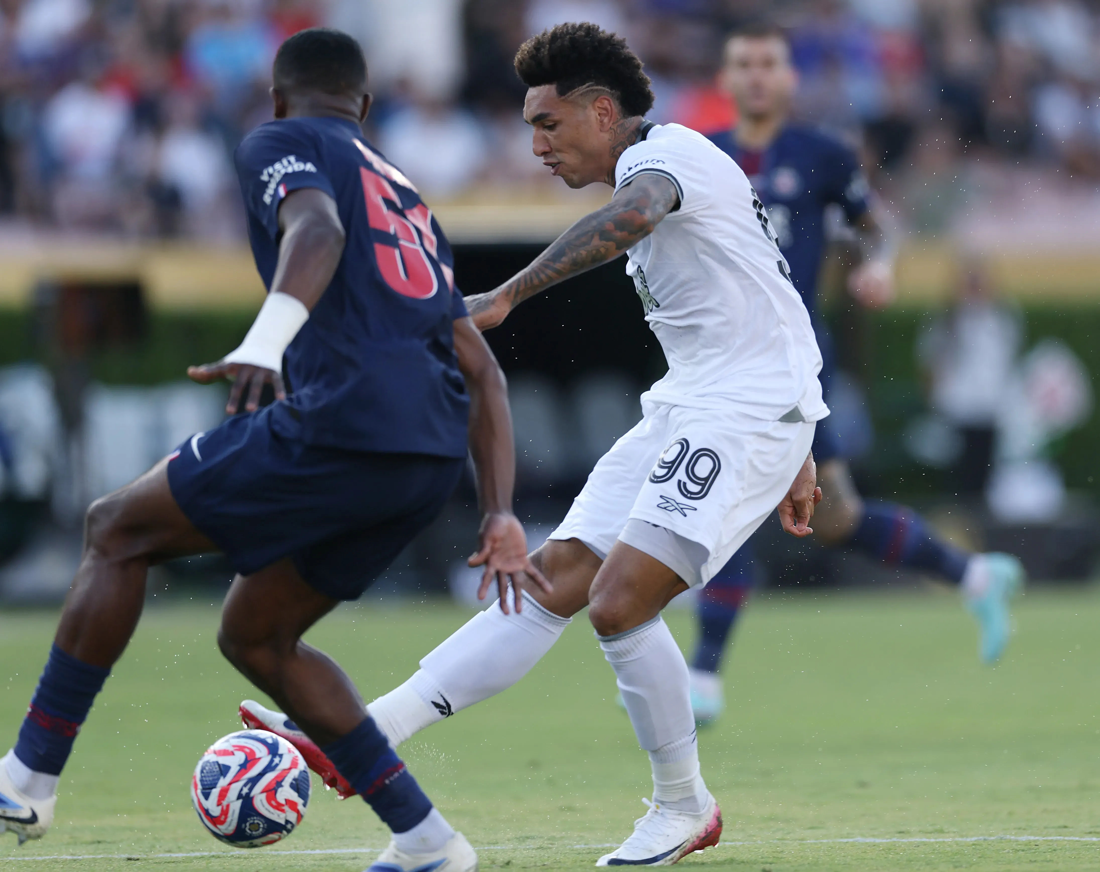 Igor Jesus #99 of Botafogo scores his team’s first goal whilst under pressure from Willian Pacho #51 of Paris Saint-Germain during the FIFA Club World Cup 2025 group B match between Paris Saint-Germain FC and Botafogo FR at Rose Bowl Stadium on June 19, 2025 in Pasadena, California. (Photo by Stu Forster/Getty Images)