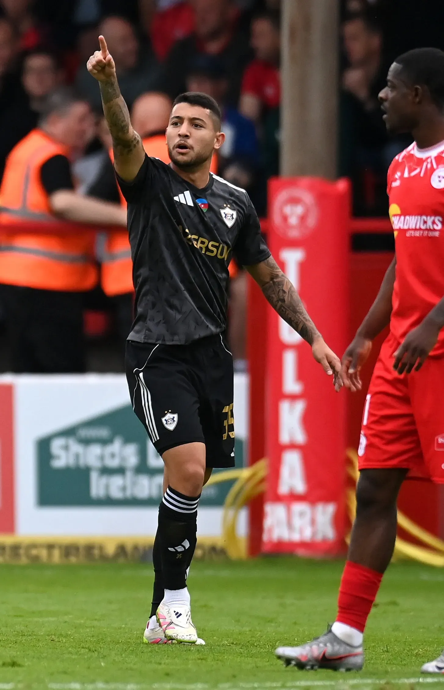 DUBLIN, IRELAND – JULY 23: Leandro Andrade of Qarabag celebrates scoring his team’s first goal with teammate Pedro Bicalho during the UEFA Champions League Second Qualifying Round First Leg match between Shelbourne and Qarabag at Tolka Park on July 23, 2025 in Dublin, Ireland. (Photo by Charles McQuillan/Getty Images)