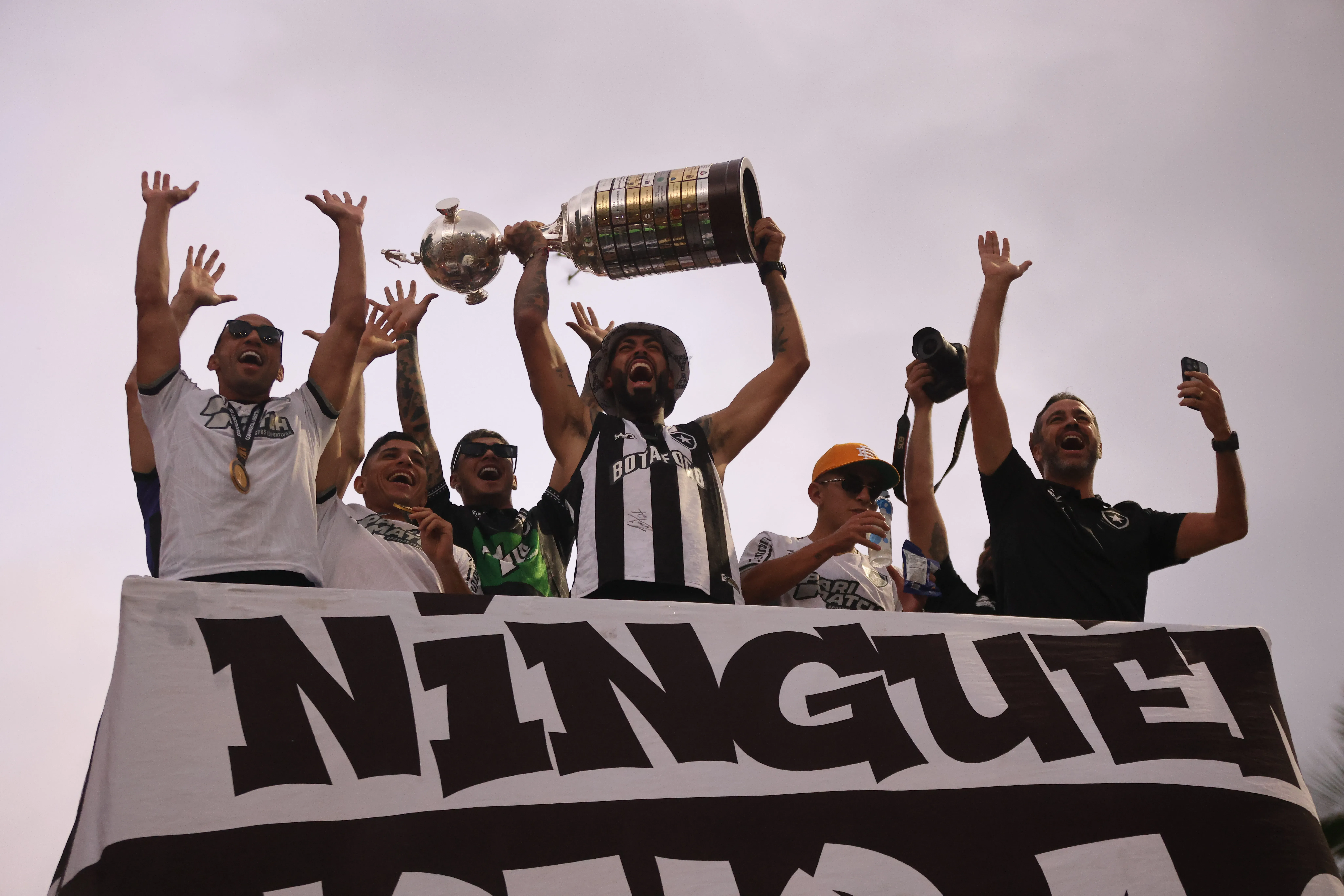 RIO DE JANEIRO, BRAZIL – DECEMBER 1: Marçal of Botafogo celebrates with Artur Jorge, Jefferson Savarino and Danilo Barbosa after winning their first Copa CONMEBOL Libertadores on December 1, 2024 at Botafogo Beach in Rio de Janeiro, Brazil. (Photo by Wagner Meier/Getty Images)