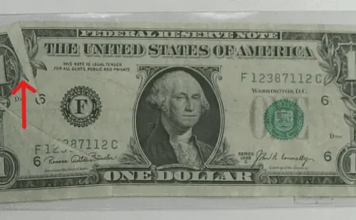 El billete de un 1 dólar con un error “Glutter note”.